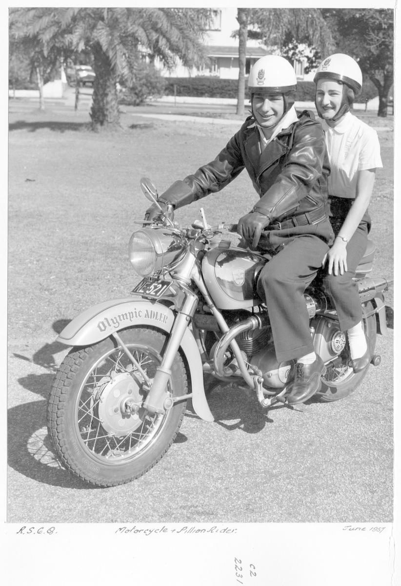 Motorcycle and pillion rider - Brisbane, June 1957