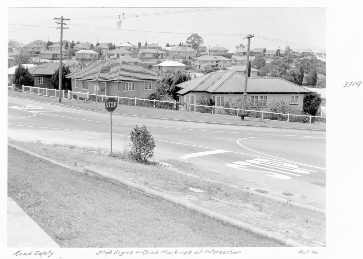 Stop sign and road markings at intersection - Brisbane, October 1960