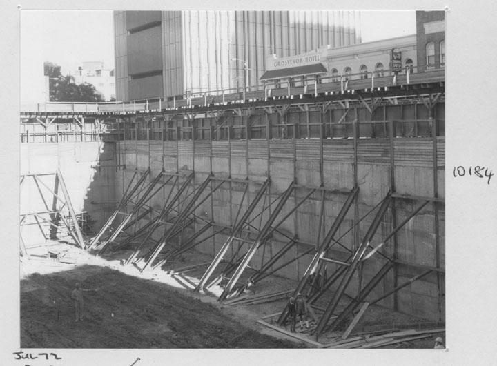 Construction of the State General Insurance Office (SGIO) building - Pier hole shorings being checked - Brisbane, July 1972