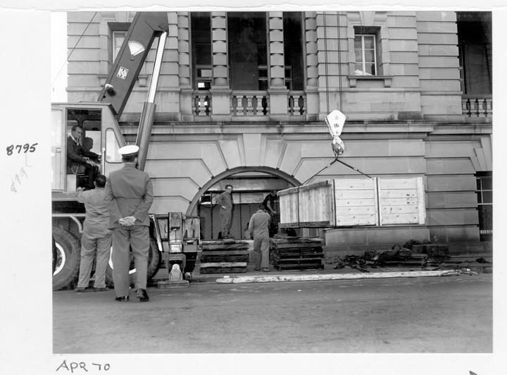 Camera rear section being unloaded and directed through window opening, William Street, Brisbane, April 1970, Brisbane City