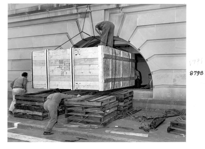 Camera rear section being unloaded and directed through the window opening, William Street, Brisbane, April 1970, Brisbane City
