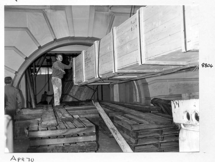Camera main beam being unloaded and directed through the window opening, William Street, Brisbane, April 1970, Brisbane City