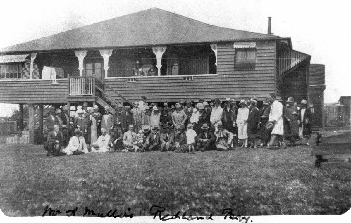 Very large group of people outside the home of A. Muller, Redland Bay, 1927