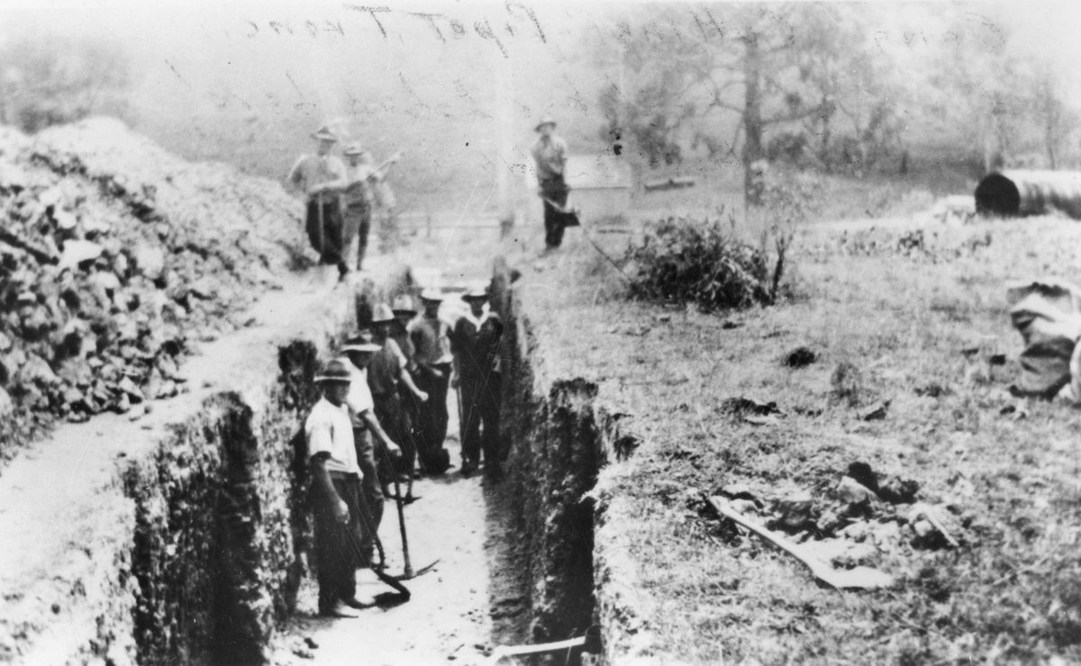 Workmen in a pipe trench near Mount Crosby, Queensland, 1923