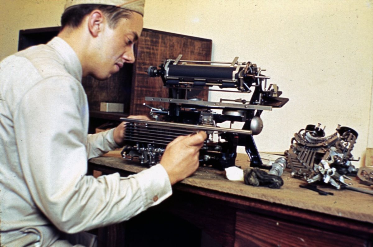 Teletype being repaired at Base Section, no. 3 headquarters at Somerville House, Brisbane, 1942