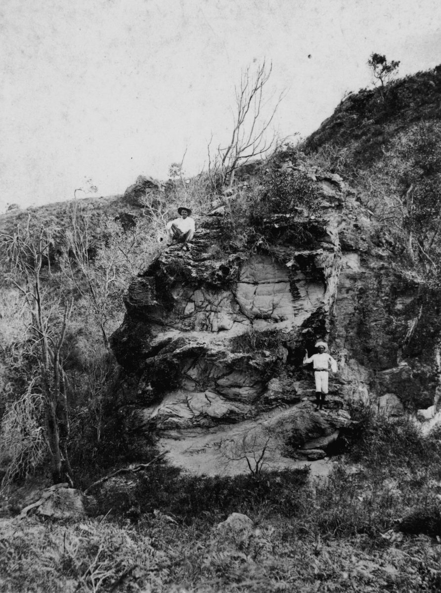 Man and boy on a cliff-face at Clayfield, Brisbane, 1907