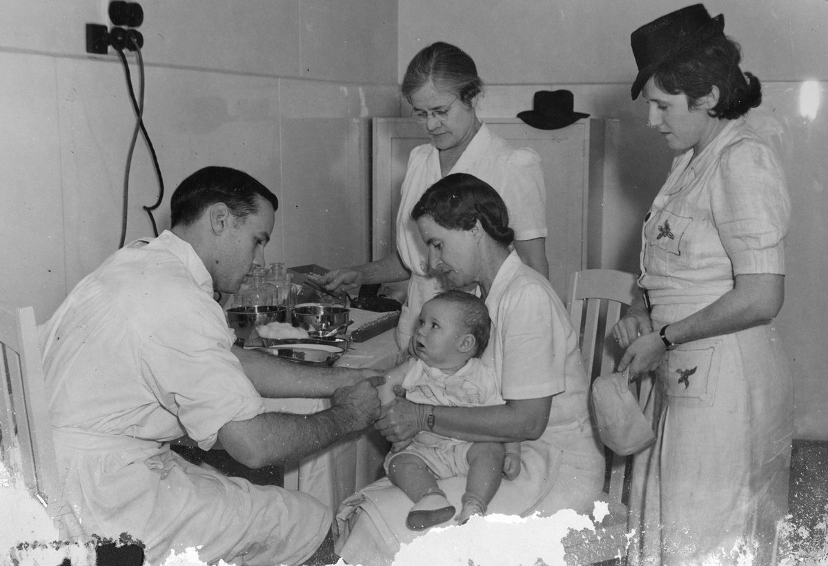 Small child being vaccinated at City Hall, Brisbane, 1947, Brisbane City