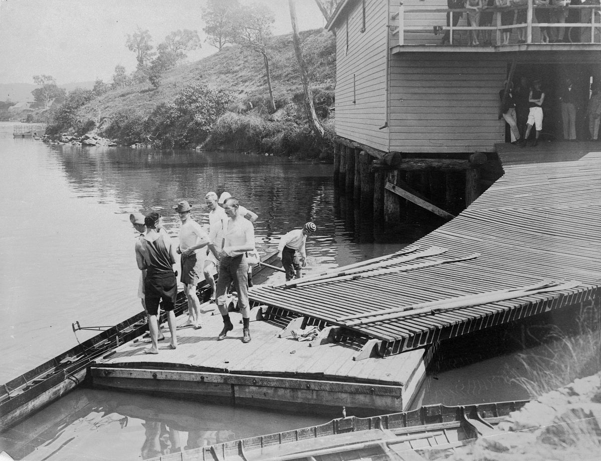Rowers standing on the pontoon near the Brisbane Rowing Club in 1897, Toowong