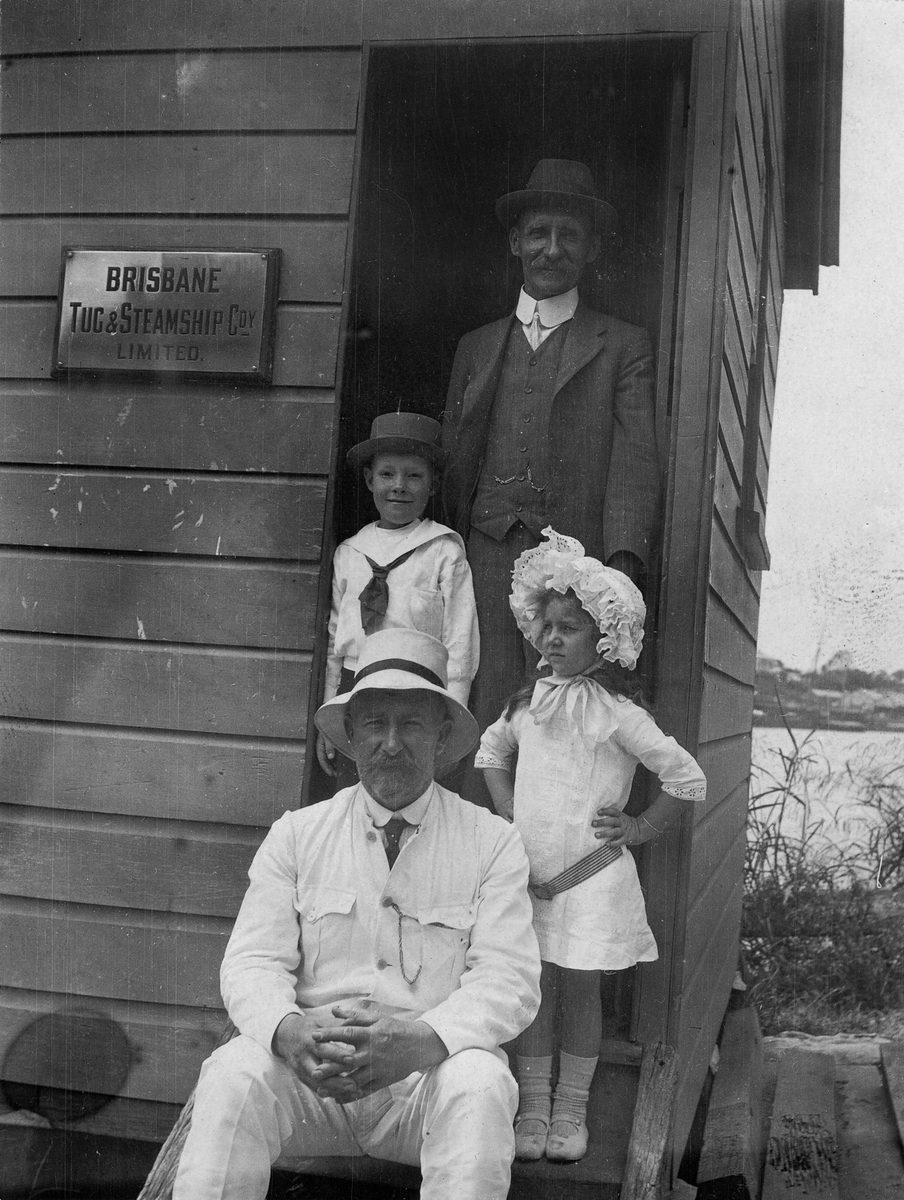 People posing at the office of Brisbane Tug and Steamship Co. Limited in Brisbane, 1913