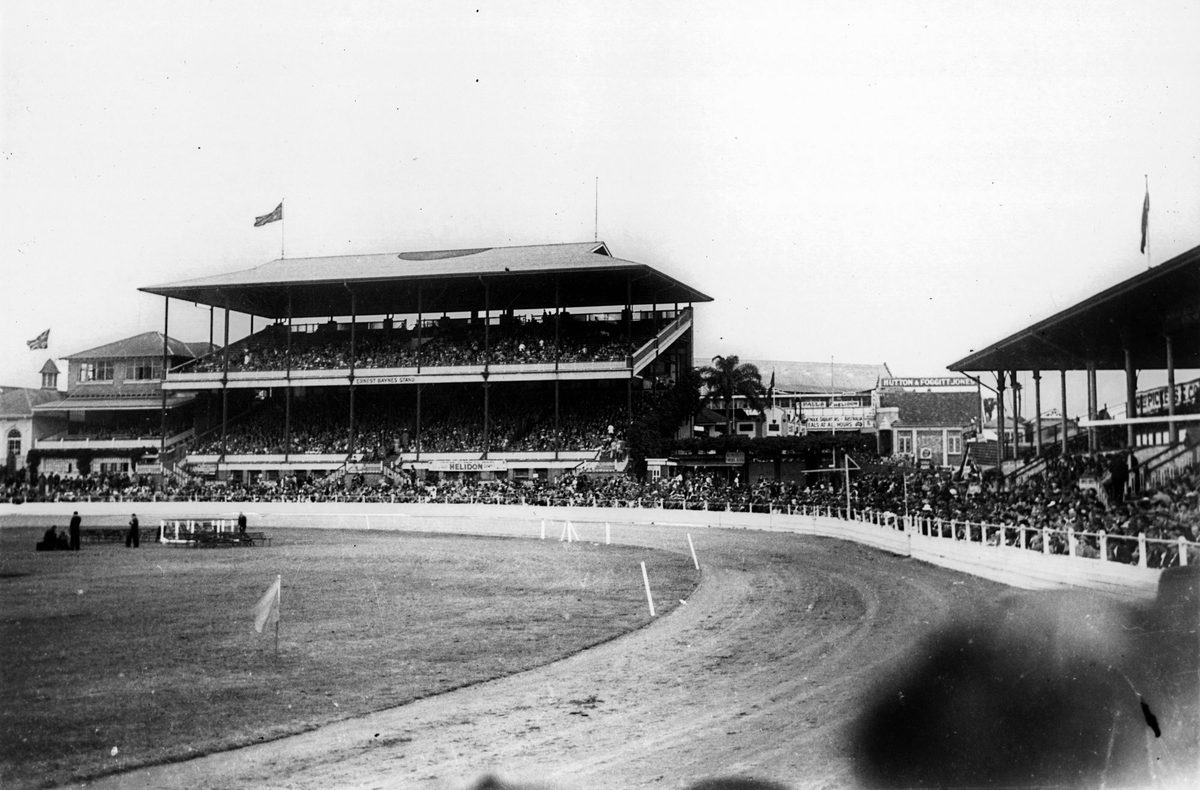 Crowds fill the grandstands and perimeter of the main show ring to watch events at the RNA Show, Brisbane 1948, Bowen Hills
