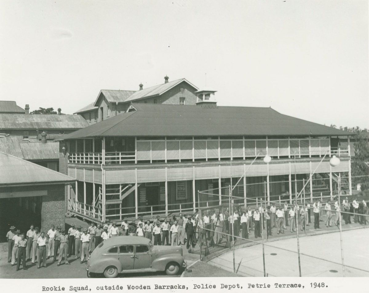 Police recruits lined up outside the wooden barracks at the police depot on Petrie Terrace in Brisbane, 1948