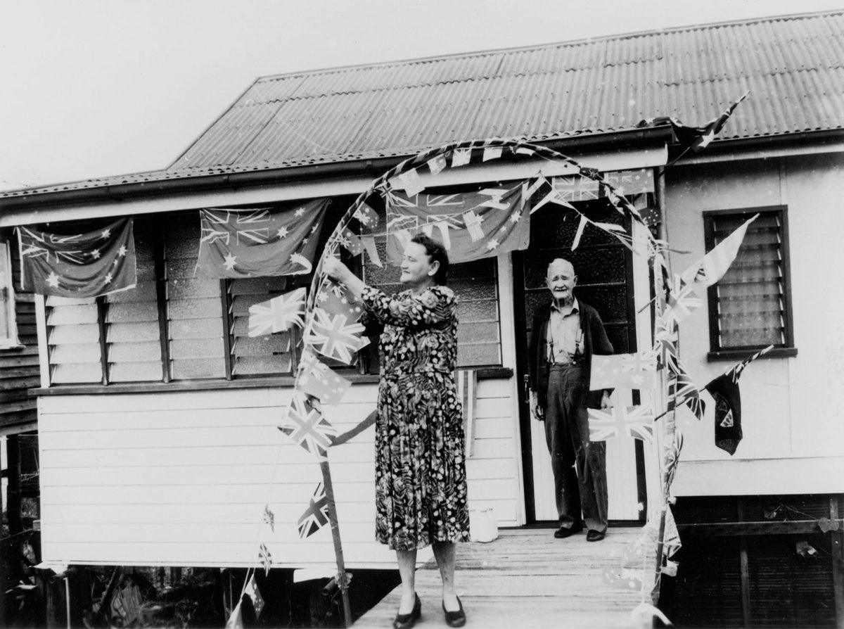 Brisbane residents decorate a cottage in preparation for the Royal Visit, March 1954, Paddington