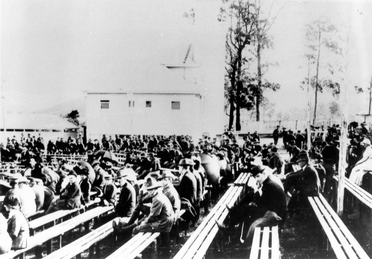 Sitting on benches at the Enoggera Military Camp, 1916