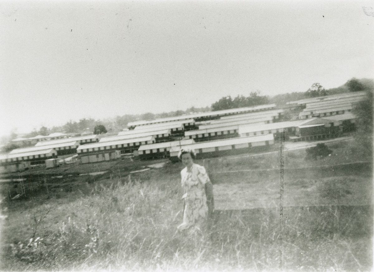Unidentified woman standing near the Holland Park Military Hospital on Logan Road, 1945