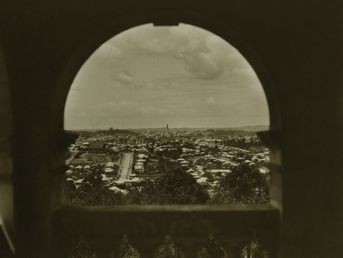 Looking towards Red Hill from a feature window in a wall at Government House, Brisbane, 1932, Paddington