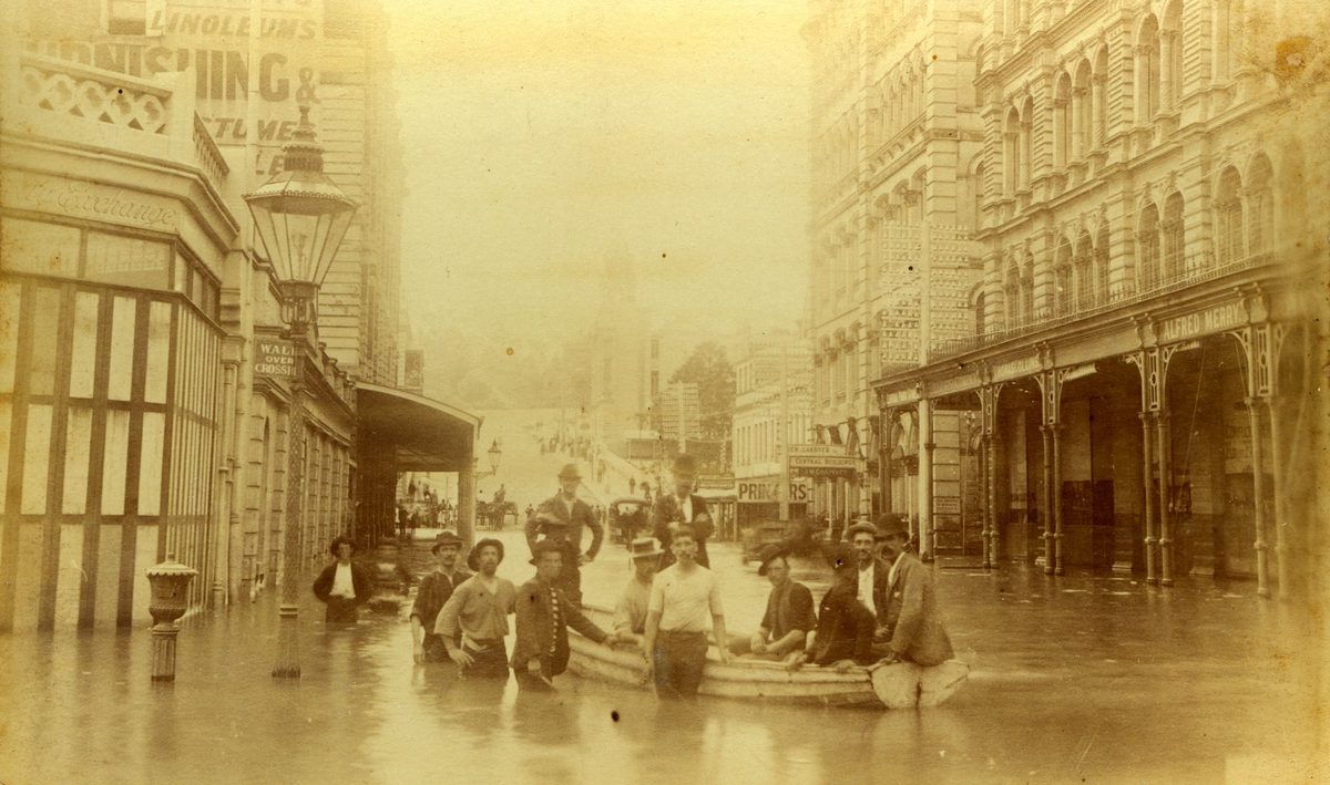 Wooden boat being used to ferry pedestrians in Brisbane's 1893 floods, Brisbane City