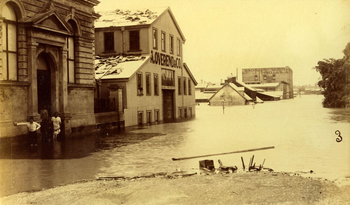 Children wading in the floodwaters down Alice Street, Brisbane, Brisbane City (1893)