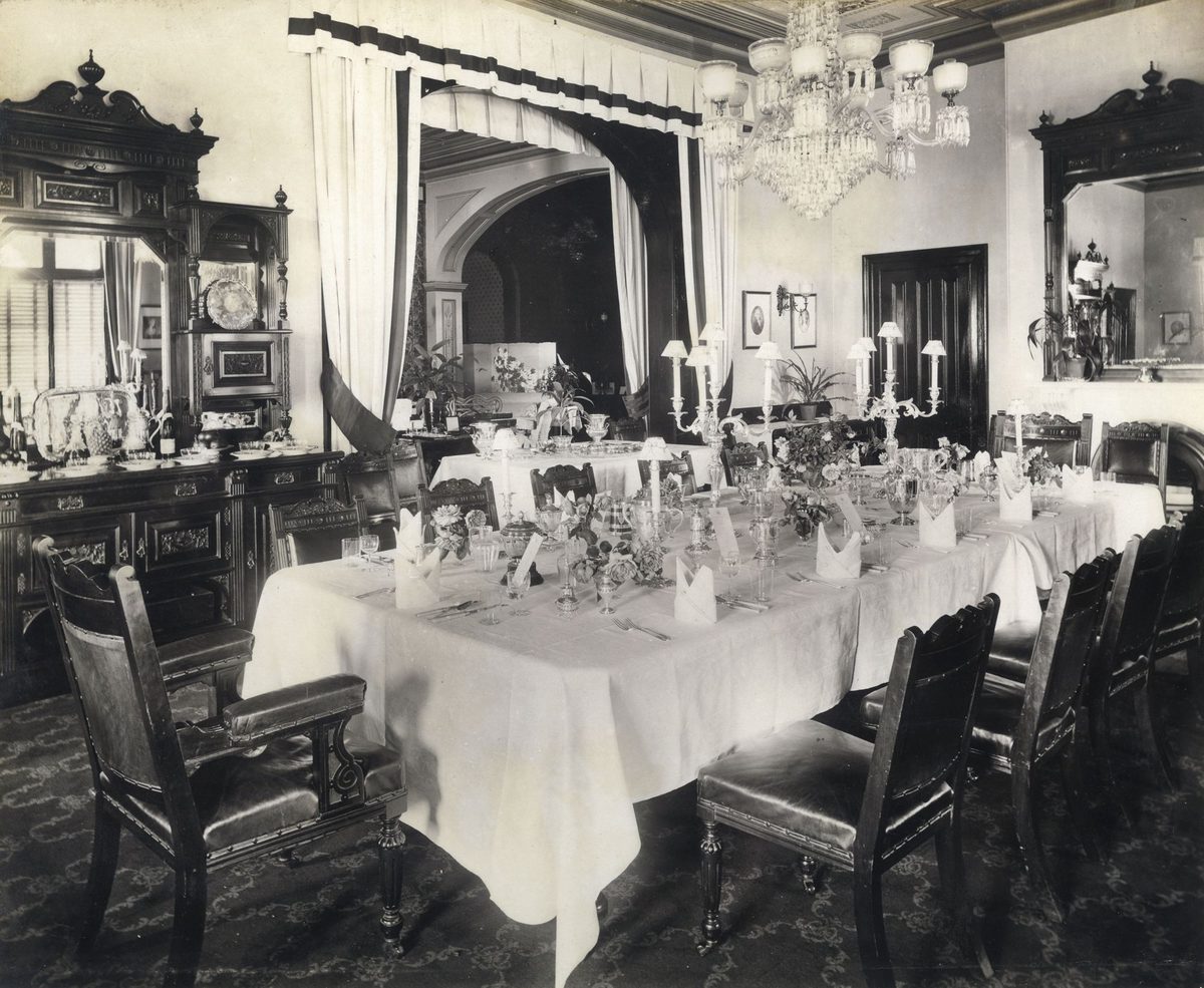 Dining room of Government House with the table prepared for dinner guests, Brisbane, 1908, Brisbane City