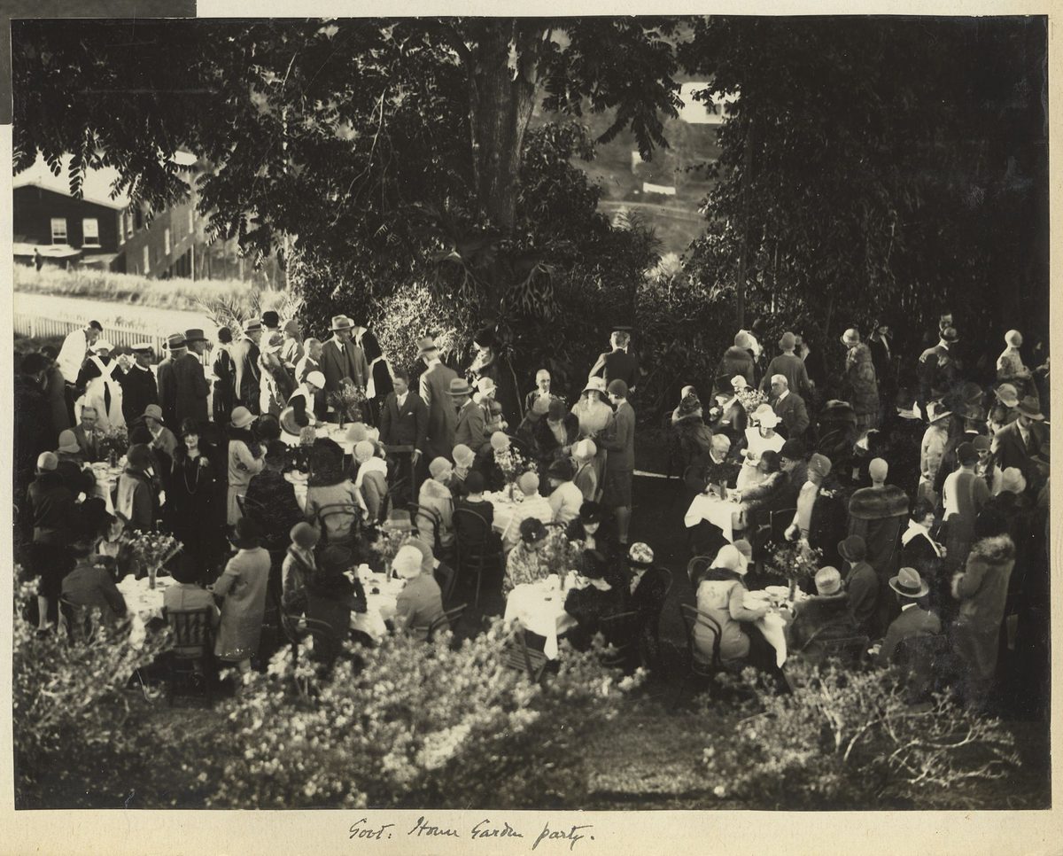 Eating outdoors in the grounds of Fernberg at the Queensland Governor's Garden Party, June 1929, Brisbane