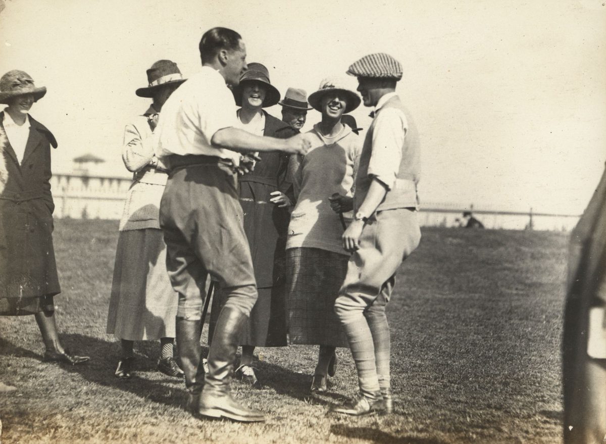 Exchanging jokes at Ascot racetrack, Brisbane, August 1920