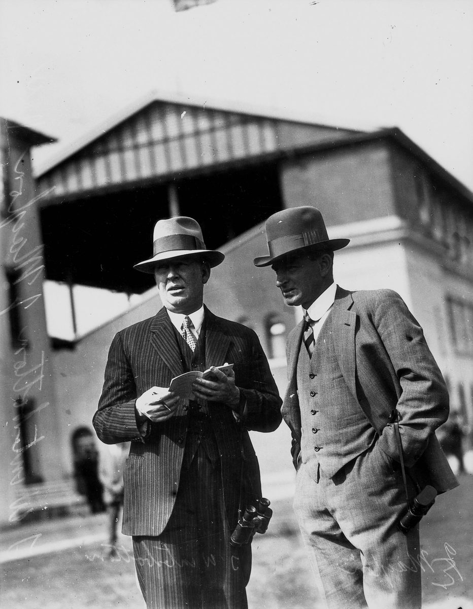 Tom Winterbottom and J. Malyon have a chat at the Tattersall's Gold Cup Race Meeting, Brisbane, August 1932