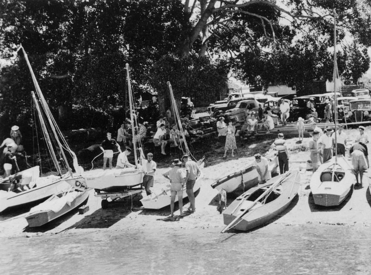 Spectators enjoy a day out at the dinghy class yacht races, Cleveland, 1953