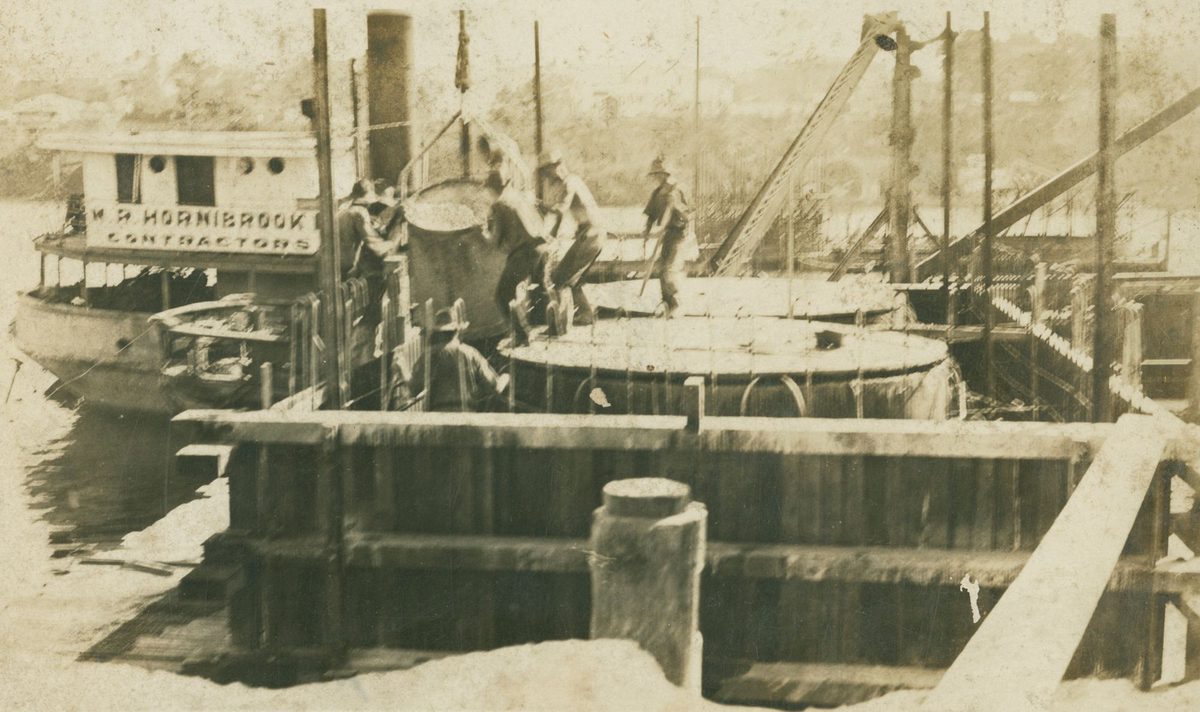 Lowering a cylinder into the bridge pier of the Grey Street Bridge, May 1929, Brisbane City