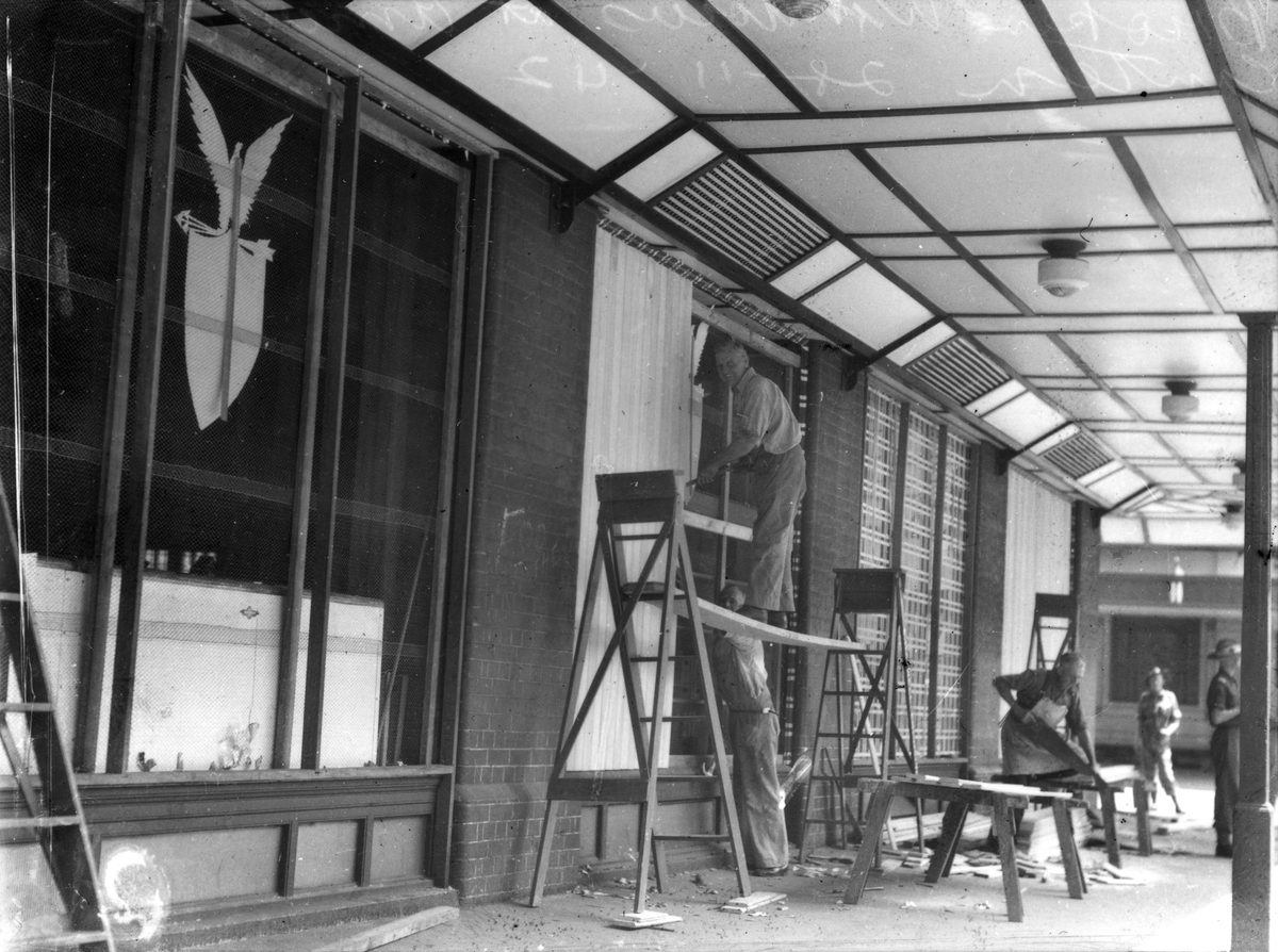 Repairing broken windows at the American canteen, Brisbane, November 1942