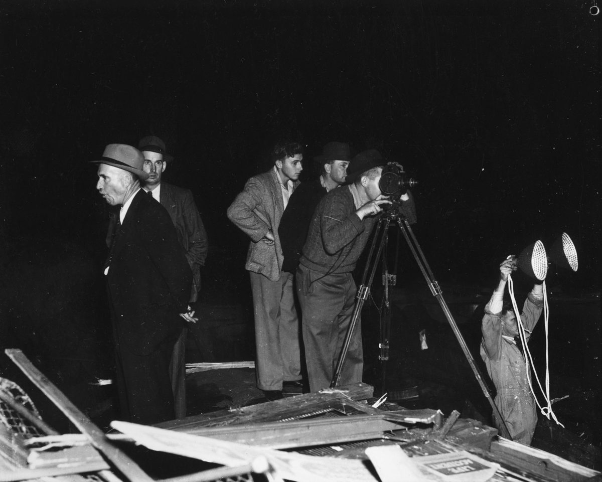 Filming at the scene of the Camp Mountain railway derailment, 1947