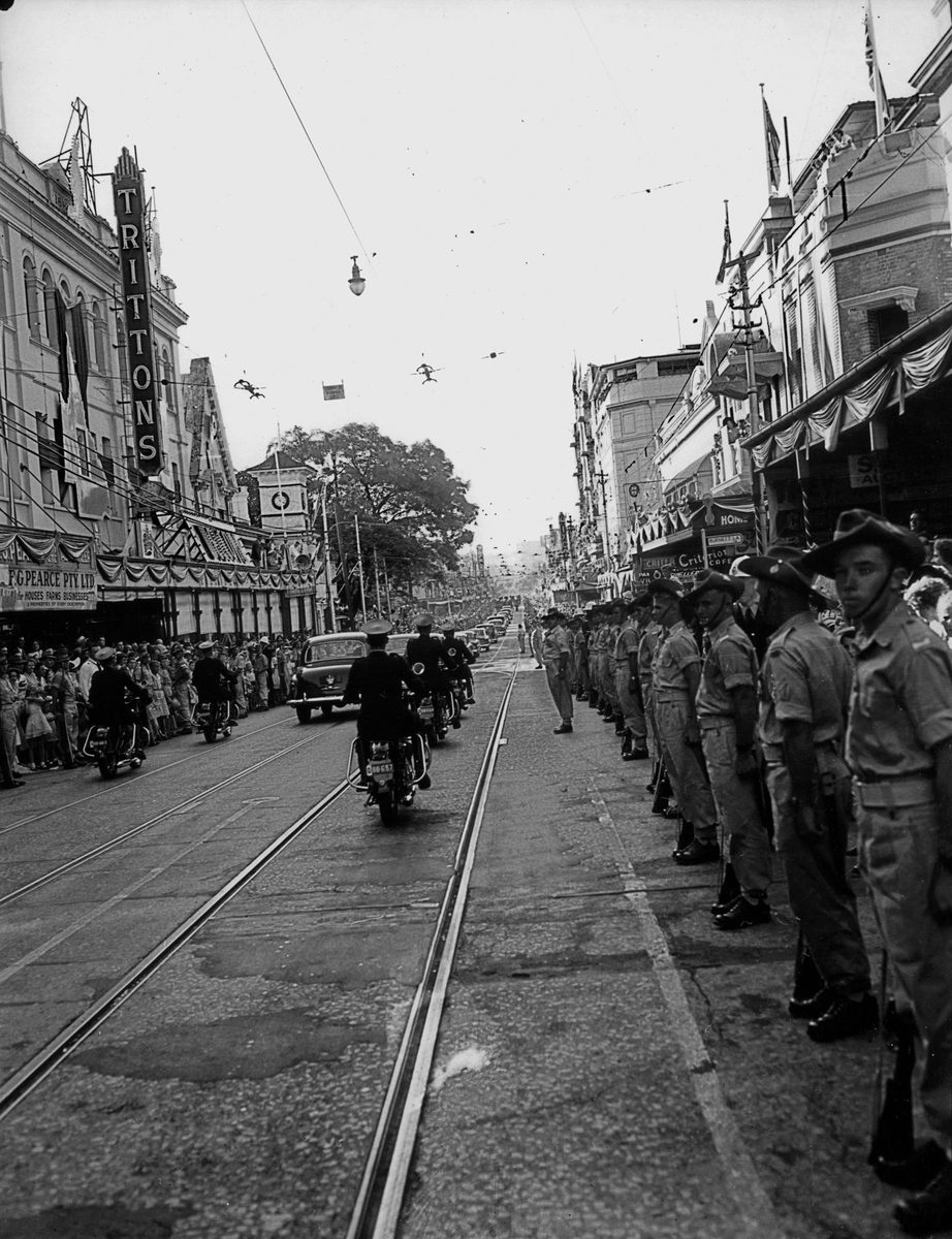 Soldiers line George Street in Brisbane for the Royal Motorcade passes, March 1954, Brisbane City