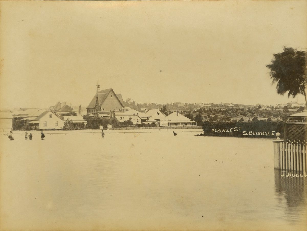People wading through the floodwaters in Merivale Street, South Brisbane, 1890