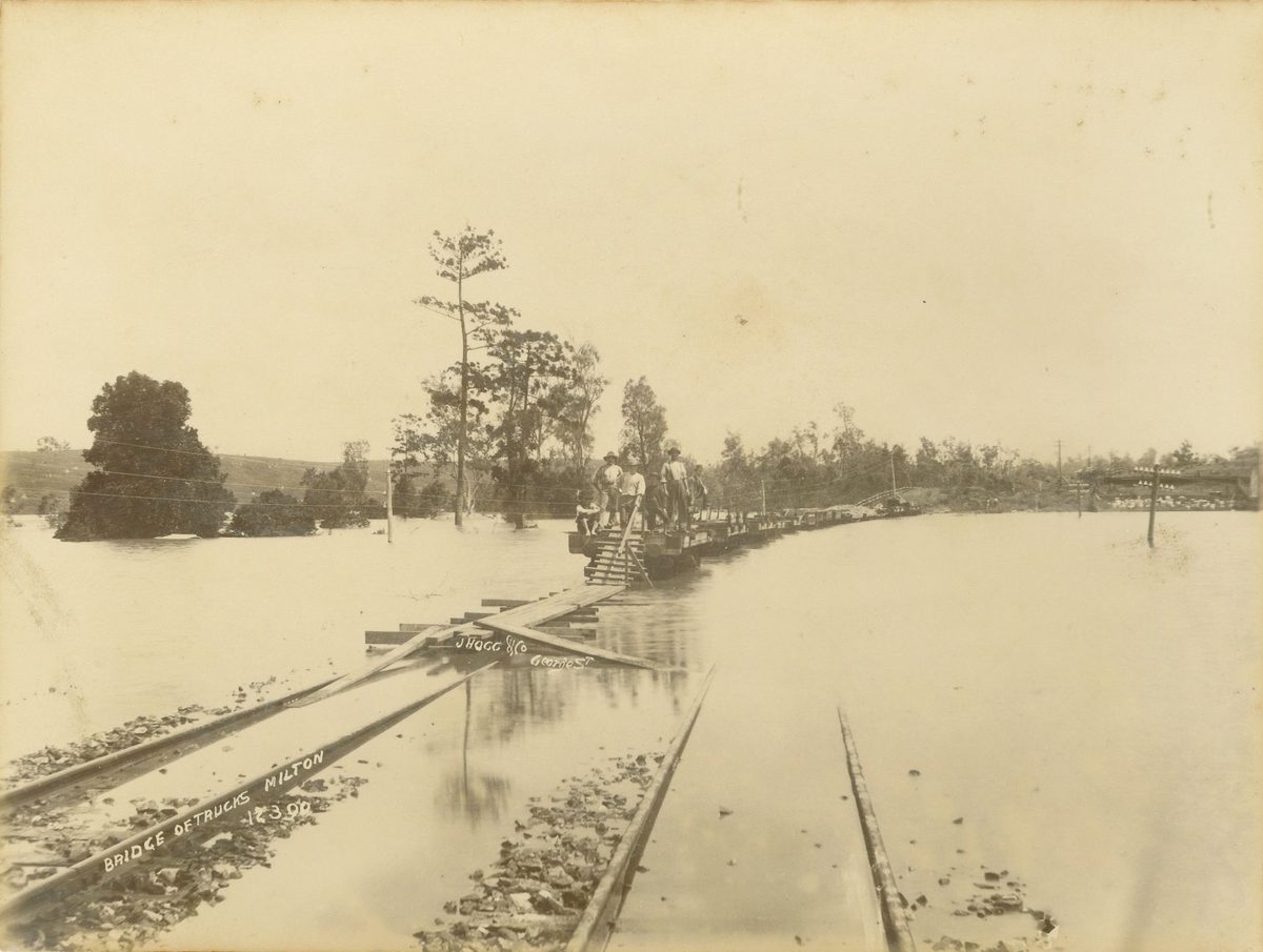 Bridge of railway trucks across the floodwaters at Milton, Brisbane, 1890