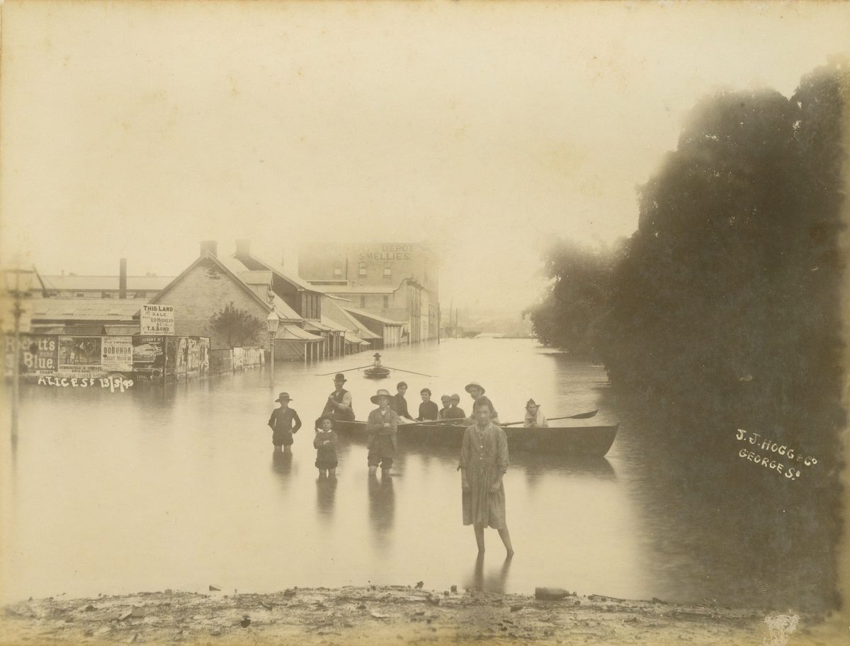 Children gathered around a boat floating in floodwaters in Alice Street, Brisbane, 1890, Brisbane City