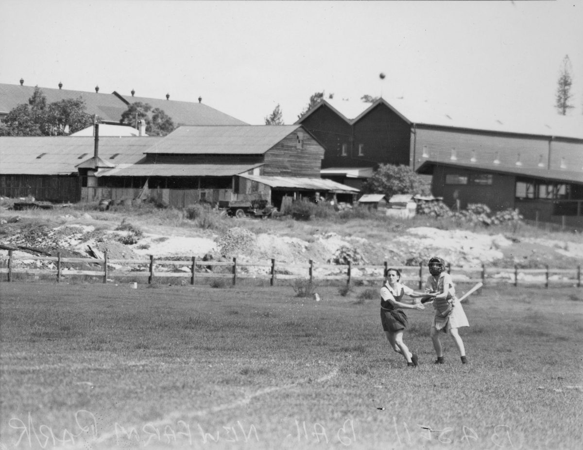 Two girls participating in a game of baseball, Brisbane, 1938