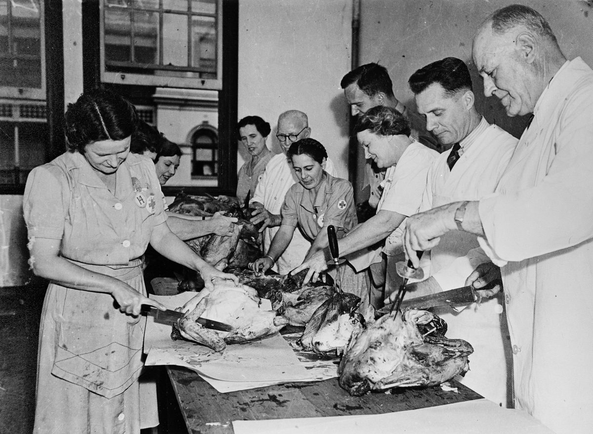 Workers carve 250 turkeys for Thanksgiving Day dinners at the American Red Cross Services Club, Creek Street, Brisbane, 1942, Brisbane City