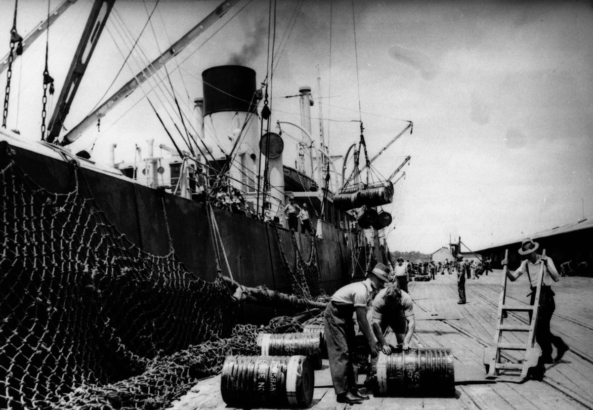 Arrival of 14,169 drums of Trinidad bitumen, at Brisbane, aboard the freighter 'Larchbank', 1938