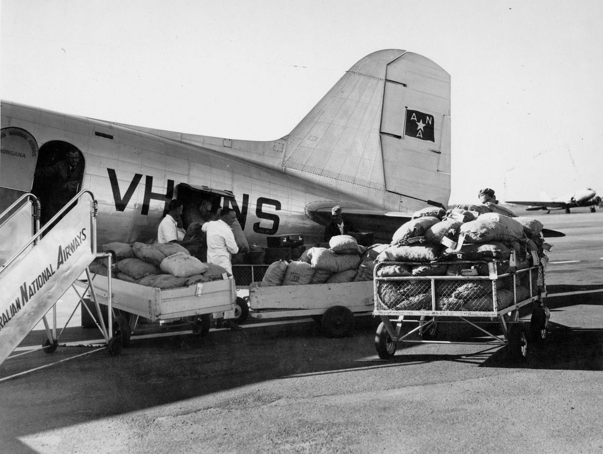 Unloading cargo from an A.N.A. plane, Brisbane, Queensland, 1949