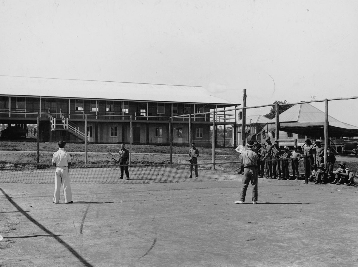 Playing tennis at the Farm Training School, St. Lucia, Brisbane, 1936, St Lucia