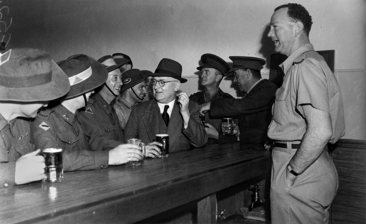 Soldiers having a drink at the Army Service Club canteen wet bar, Brisbane, 1942