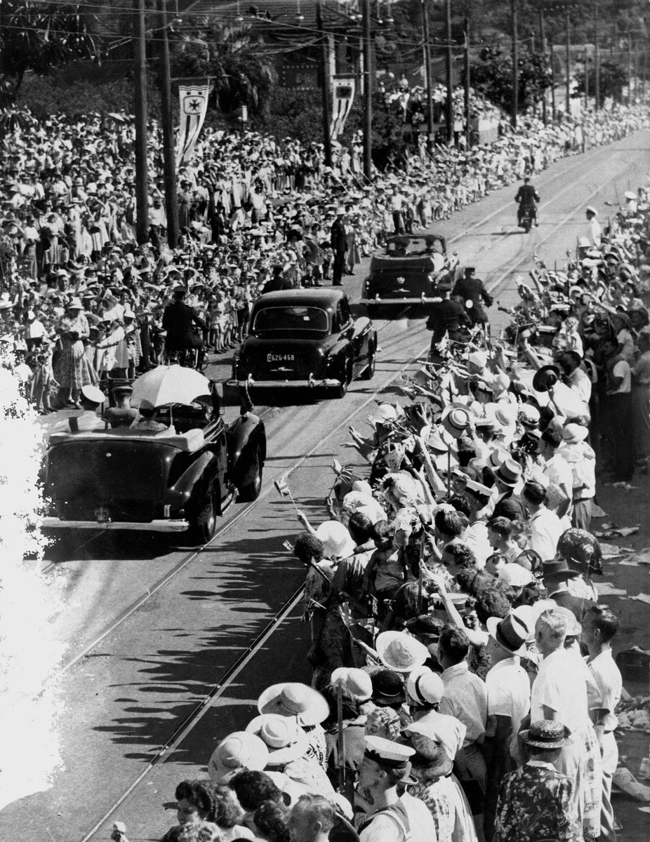 Crowds line the streets to see Queen Elizabeth II after her arrival in Brisbane in March 1954