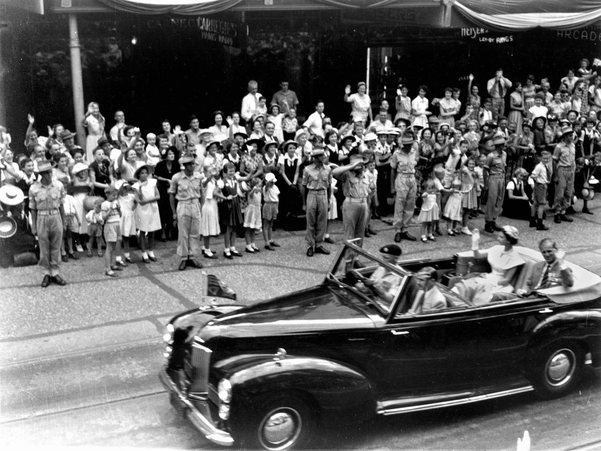 Queen Elizabeth II and the Duke of Edinburgh travel along Queen Street, Brisbane, on the last day of their Queensland tour in 1954, Brisbane City