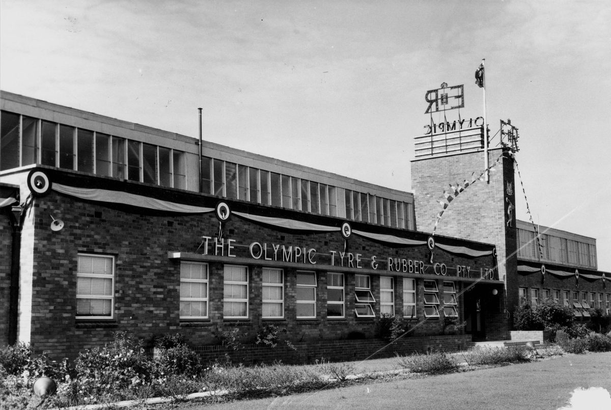 Olympic Tyre & Rubber Co. decorated their building to welcome Queen Elizabeth II and Prince Philip in 1954, Brisbane