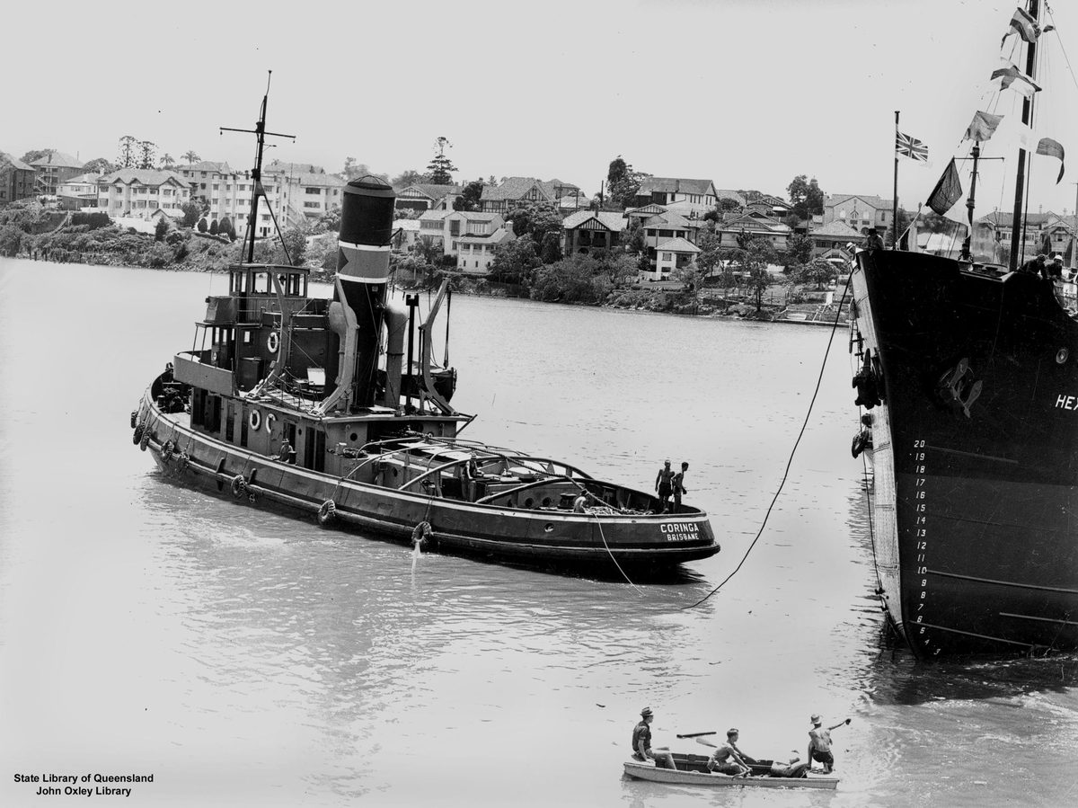 Tug boat Coringa assisting in the launch of a ship in the Brisbane River, 1953