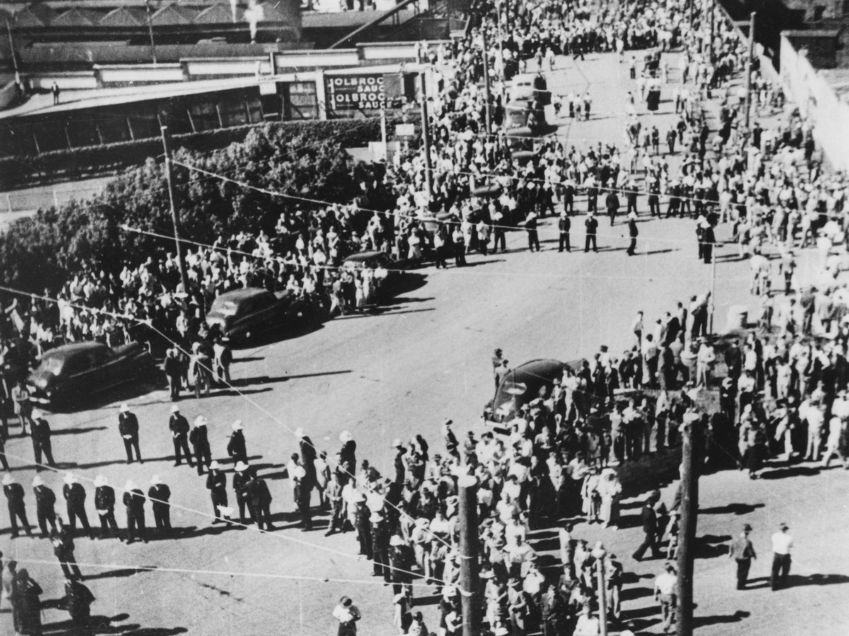 Crowds and police in Edward Street infront of the Trades Hall during the Railways Strike, Brisbane, 1948, Brisbane City