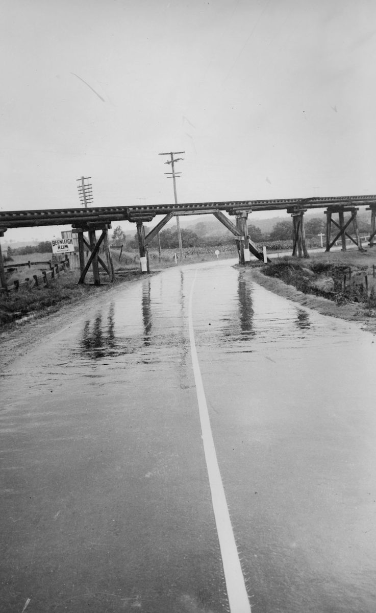 Single line marking on the road under Yatala Railway Bridge, 1940