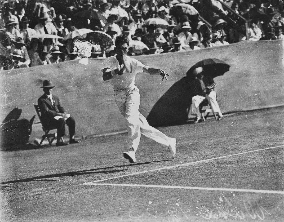 Englishman Frank Wilde hits a forehand against an Australian opponent at Milton, 1933