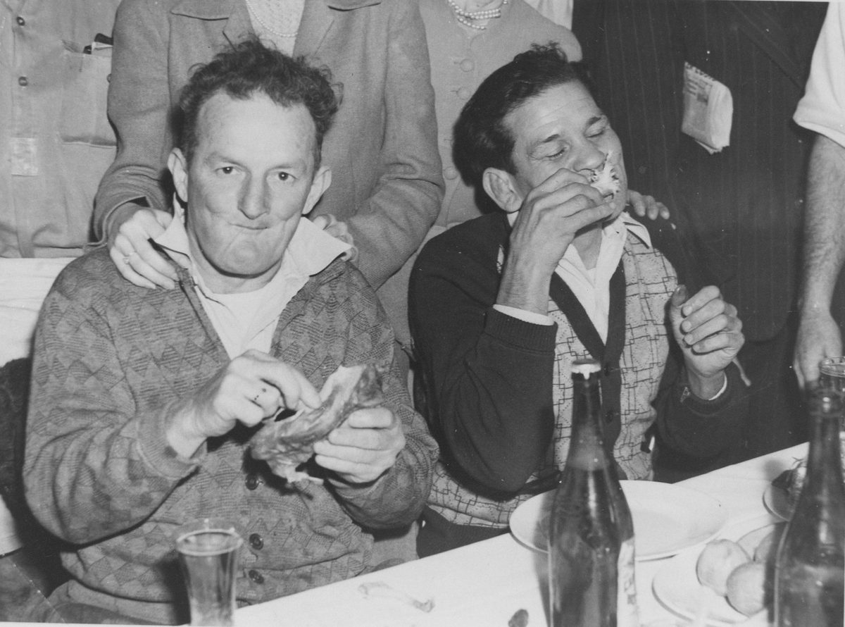 Wharfies enjoying a meal after release from jail for breaching Hanlon's anit-picketting Act, 1948, Brisbane