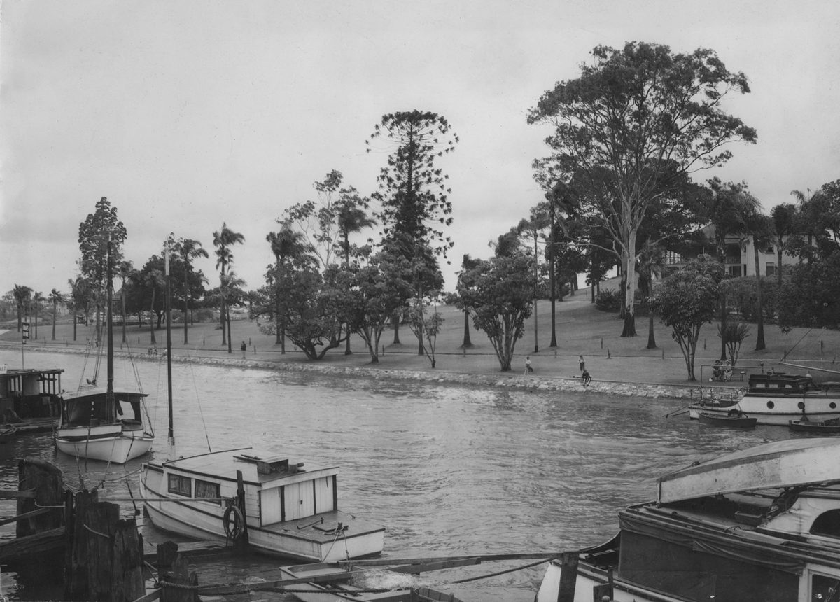 View of boats moored in Breakfast Creek with Newstead Park in the background, Brisbane, 1950
