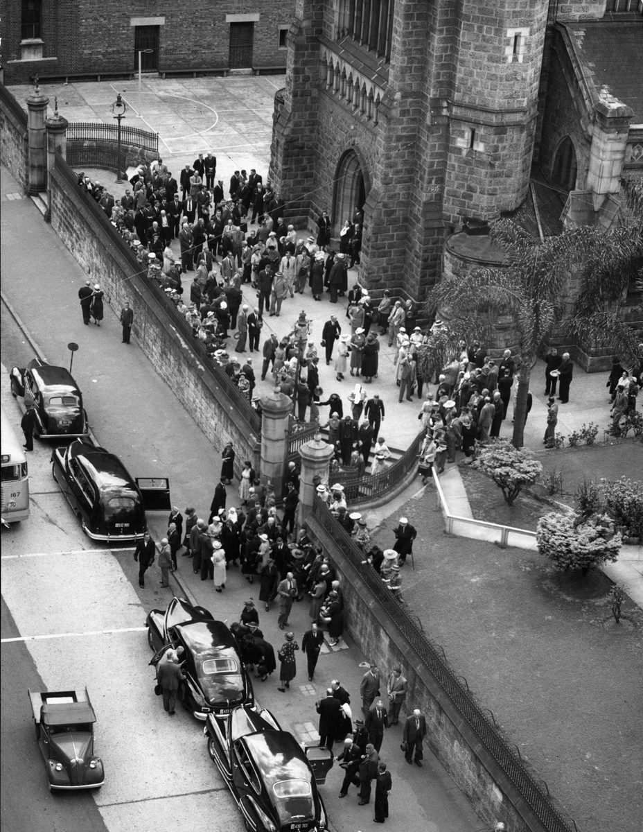 Mourners leaving St Stephen's Cathedral following Requiem Mass for RCF Byrne, Chief Stipendiary Magistrate in 1952, Brisbane City