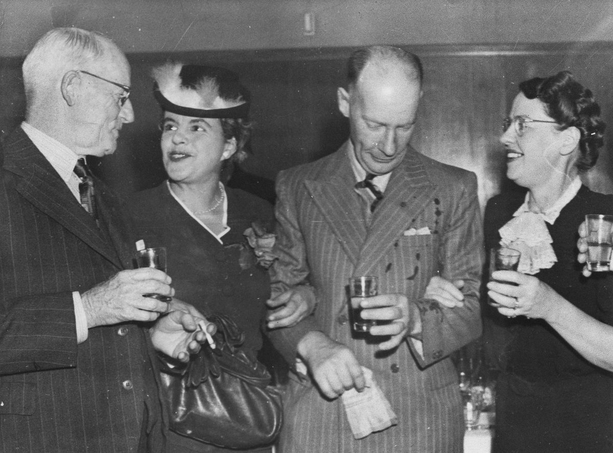Two couples attending the James Campbell & Sons centenary celebration in Brisbane, 1954